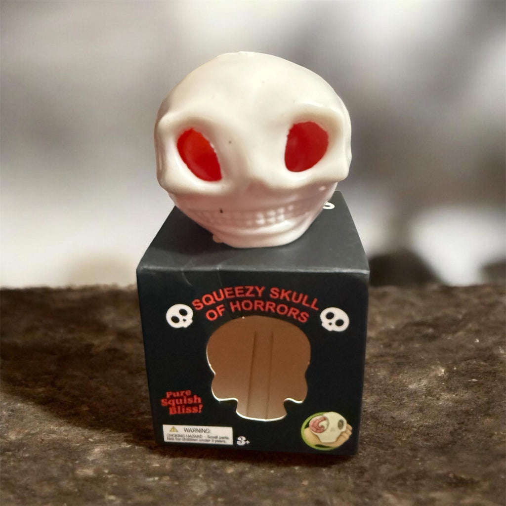 GLOW-IN-THE-DARK HORROR SKULL SQUISHY WITH SURPRISES